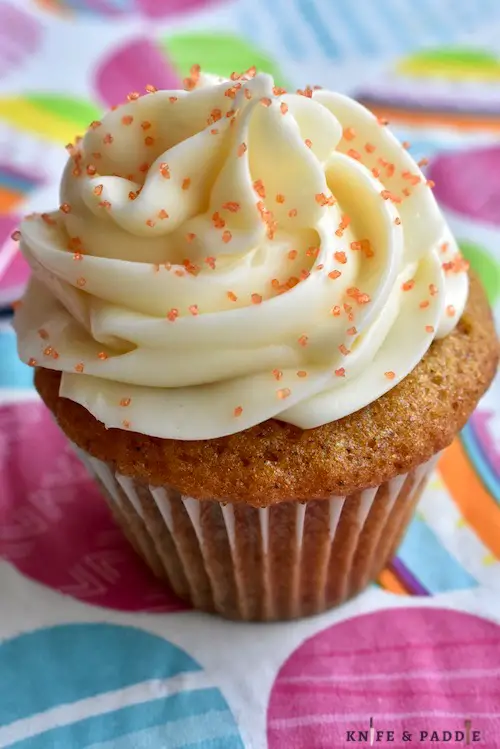 Mini Carrot Cake Cupcake with cream cheese frosting and orange coarse sparkling sugar