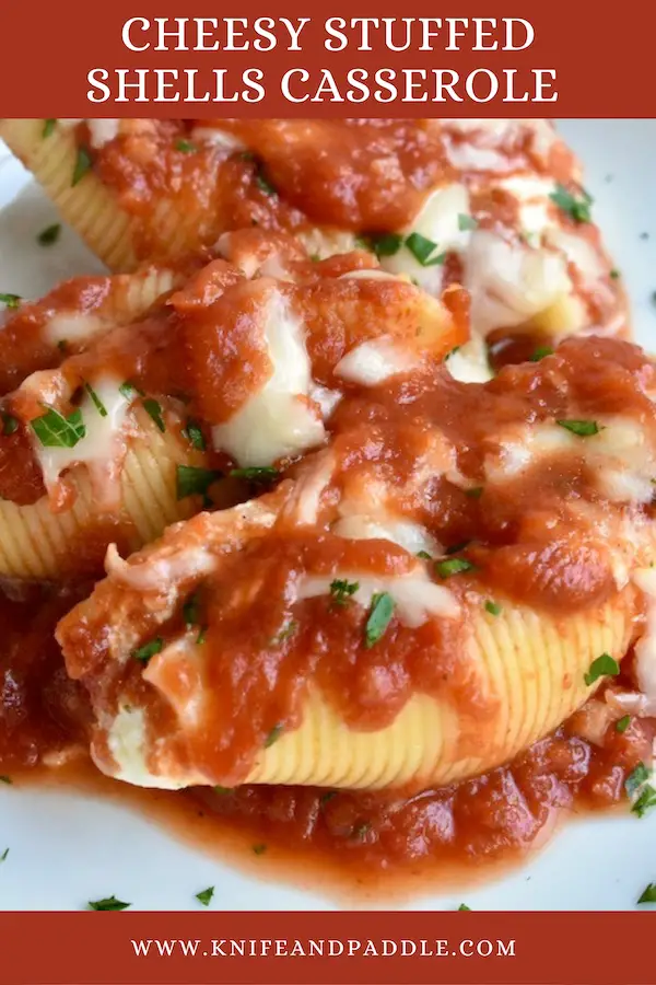 Cheesy stuffed shells with sauce topped off with fresh mozzarella cheese and parsley