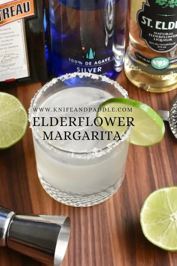 The Elderflower Margarita in a salted rimmed glass with a lime slice