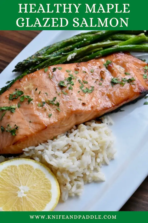 Healthy Maple Glazed Salmon with white rice and asparagus on a plate with a lemon wedge
