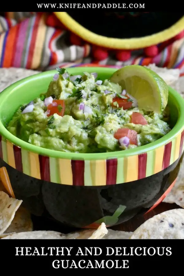 Healthy and Delicious Guacamole served in a bowl with tortilla chips