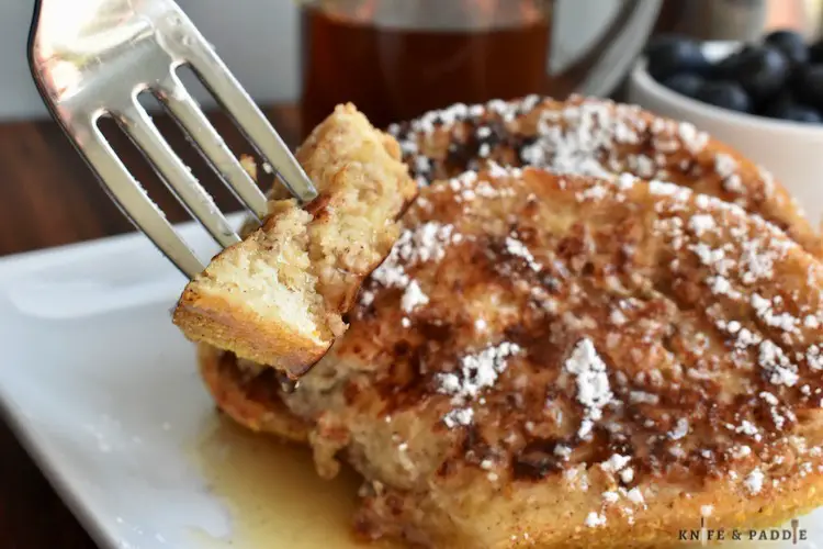 Delicious breakfast served with powdered sugar and maple syrup