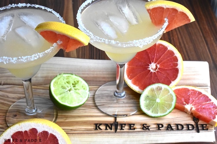 Refreshing Grapefruit Margarita with a grapefruit wedge and a salt rimmed glass
