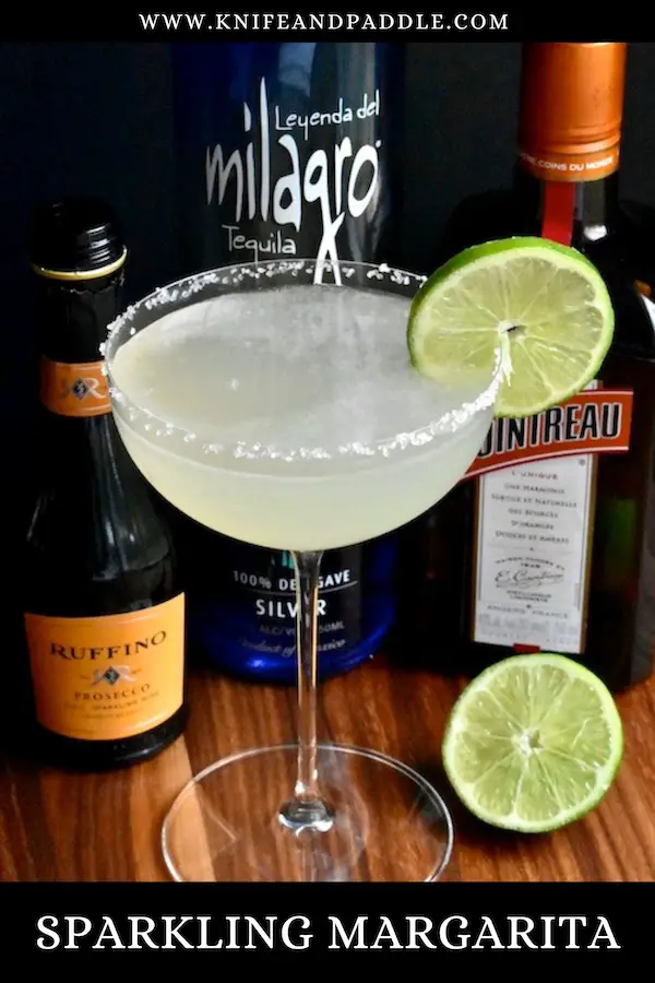 Sparkling Margarita in a coupe glass garnished with a lime slice