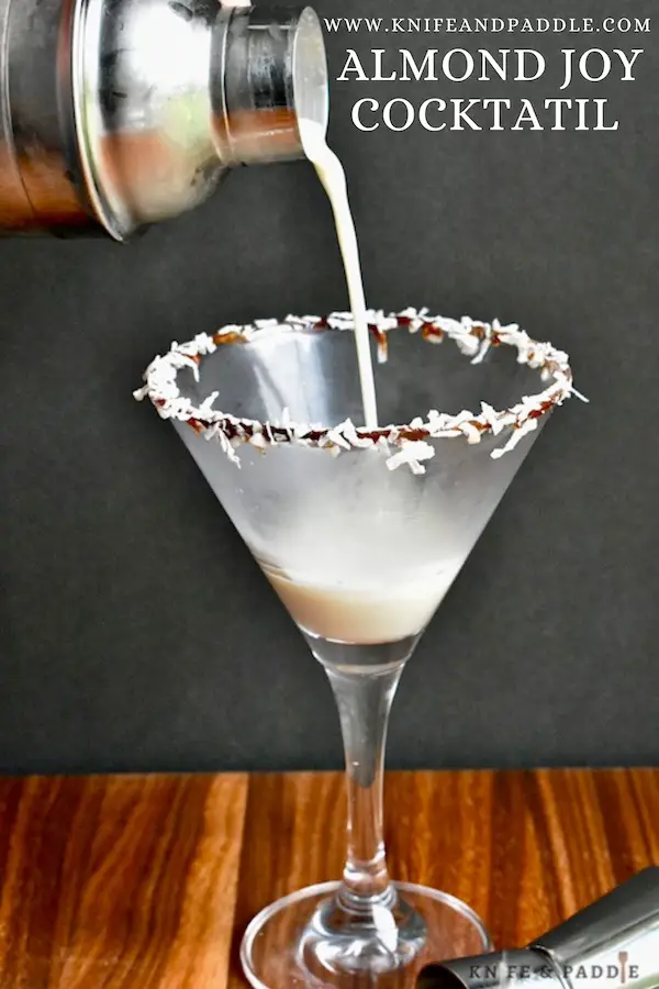 Coconut Rum, Creme de Cacao, Amaretto and heavy cream shaken until cold and strained in a glass rimmed with chocolate syrup and shredded coconut