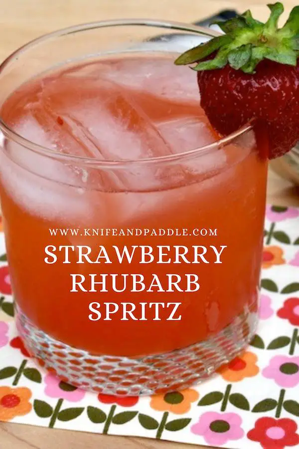 Strawberry Rhubarb Spritz garnished with a strawberry