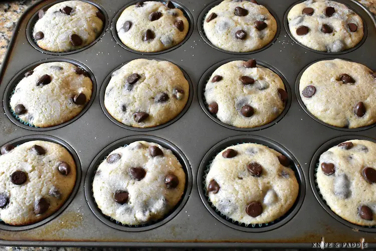 Freshly baked muffins cooling in the pan