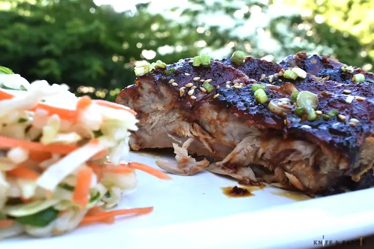 Easy Sticky Asian Ribs with a side of coleslaw on a plate