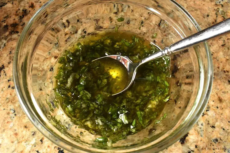 garlic, olive oil, chopped basil, salt pepper, and garlic in a mixing bowl