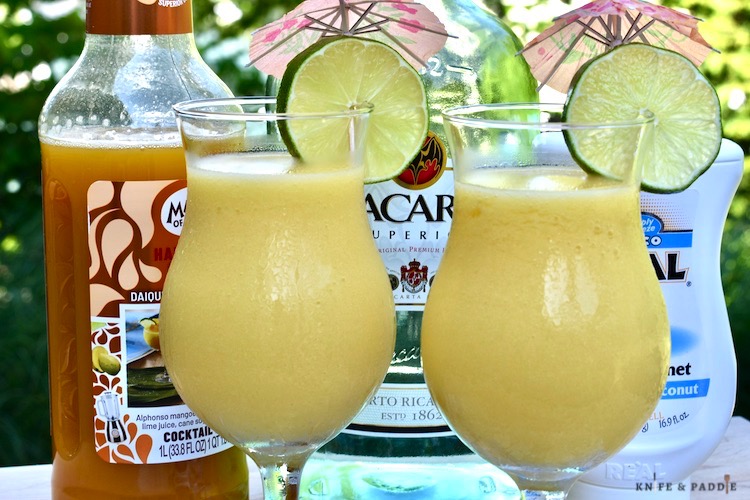 Mango juice, white rum, cream of coconut, lime juice, fresh mangoes, and ice blended until smooth and poured into a cocktail glass garnished with a lime wheel