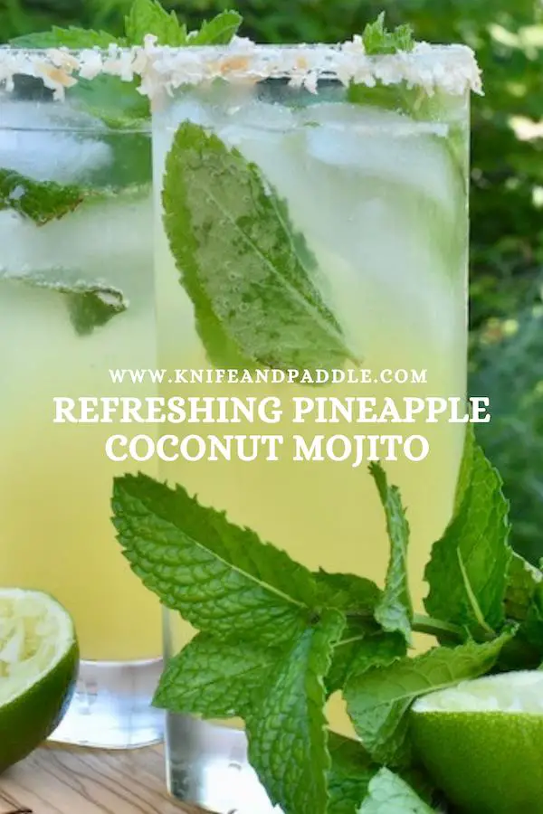 Tropical summer cocktail with fresh mint and a mixture of juices