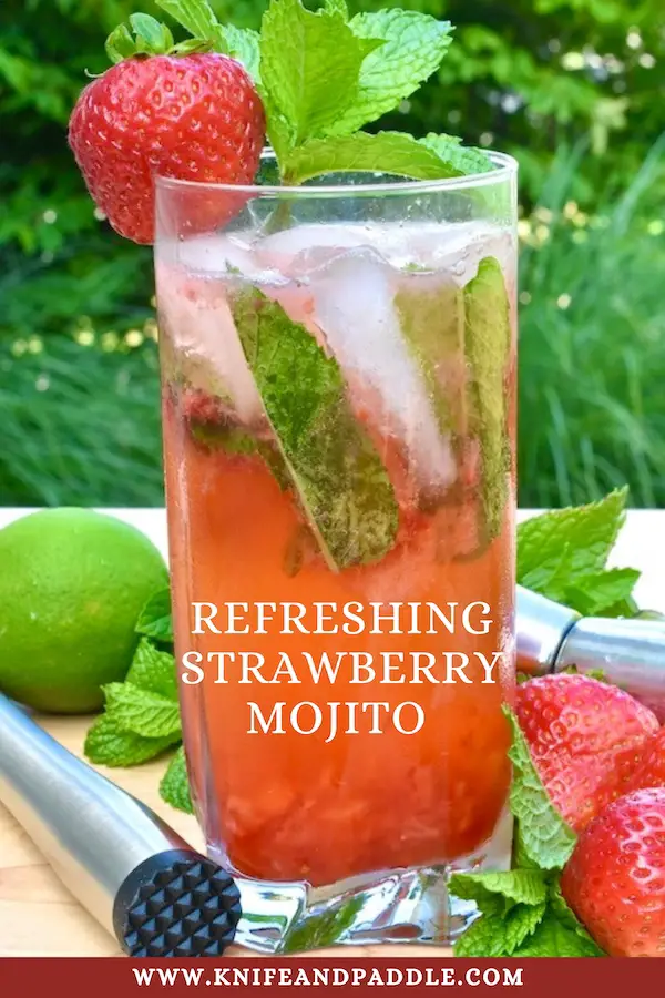 Refreshing Strawberry Mojito in a highball glass with a fresh mint sprig and strawberry for garnish