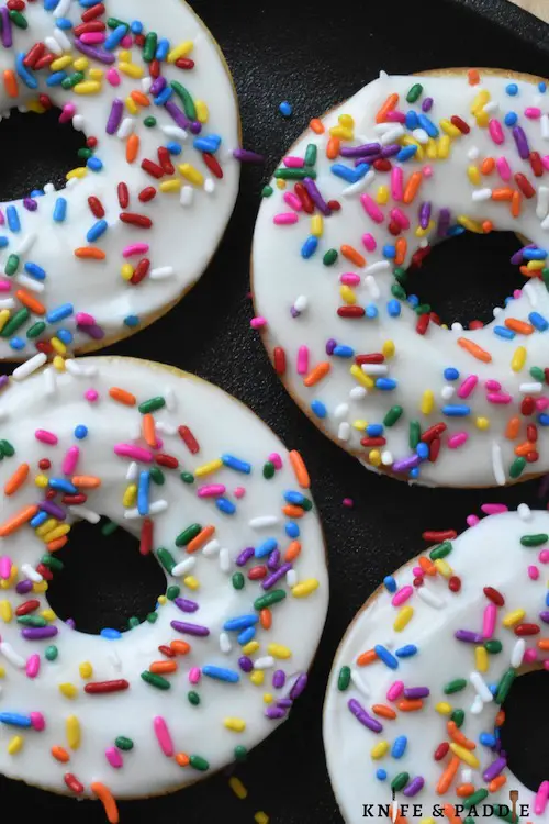 Sleepover Party Baked Vanilla Donuts with vanilla frosting and rainbow sprinkles