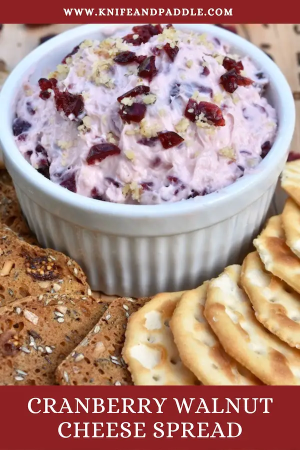 Cranberry Walnut Cheese Spread on a board with an assortment of crackers