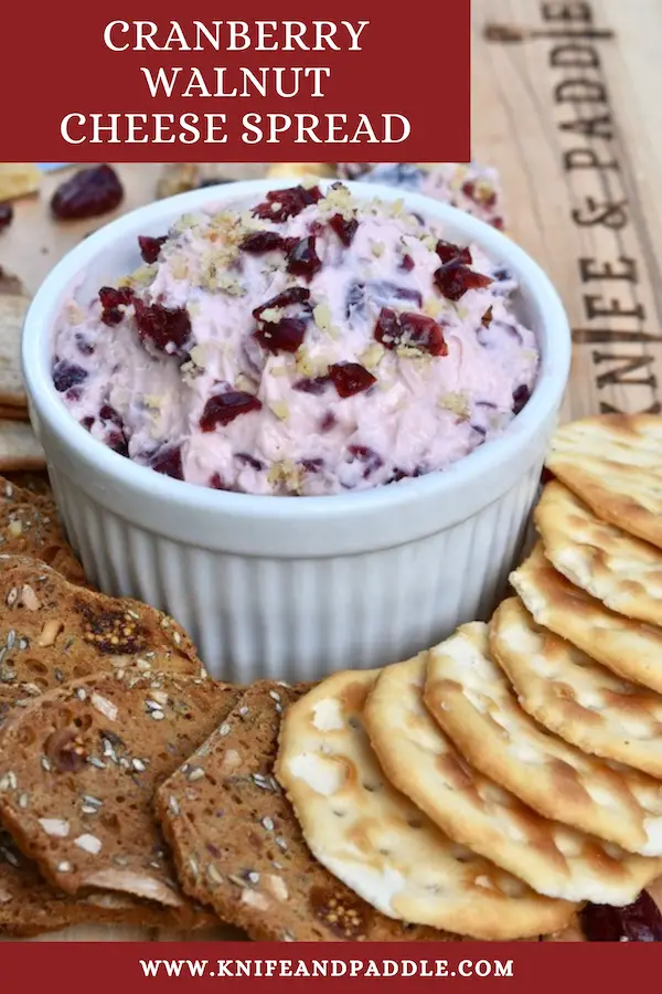 Cranberry Walnut Cheese Spread on a board with an assortment of crackers