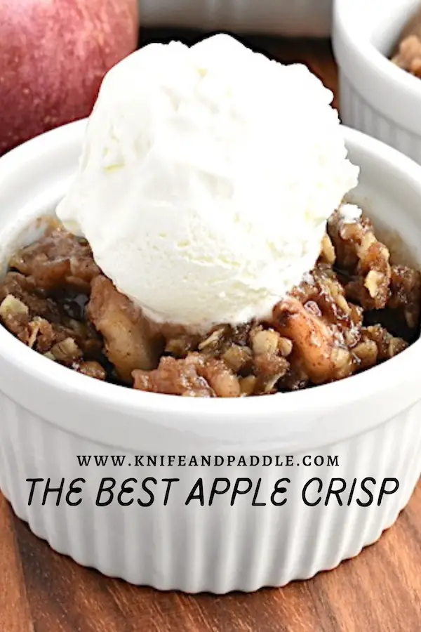 The Best Apple Crisp in a bowl topped with vanilla ice cream