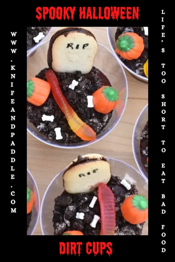 Spooky Halloween Dirt Cups with chocolate Jello pudding, crushed Oreos, candy pumpkins, candy bones, gummy worms and a RIP tombstone Milano cookie