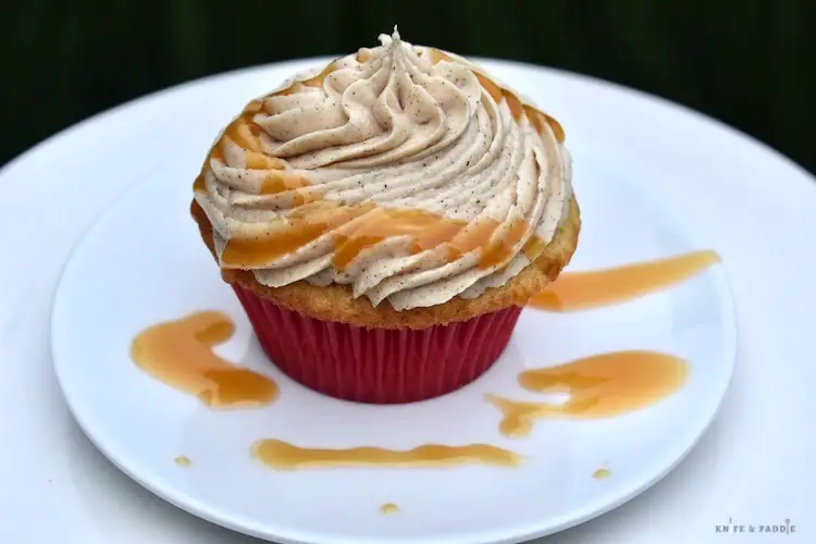 Sweet & Simple Apple Pie Cupcake with cinnamon buttercream frosting and homemade caramel sauce drizzled over the top