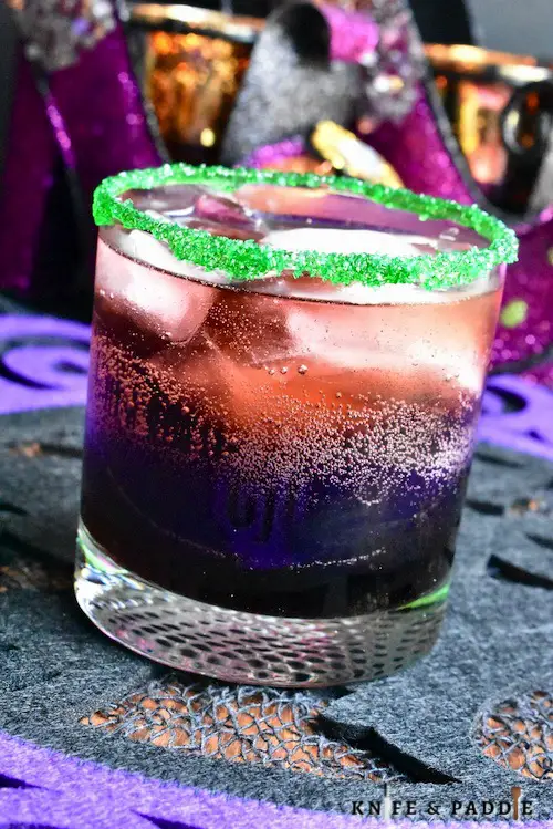 The Drunk Witch Cocktail with a bright green sugar rim
