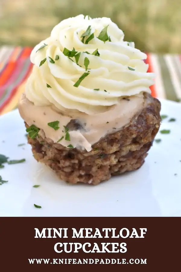 Mini Meatloaf Cupcake with mashed potato "frosting" and a sprinkle of parsley on a plate