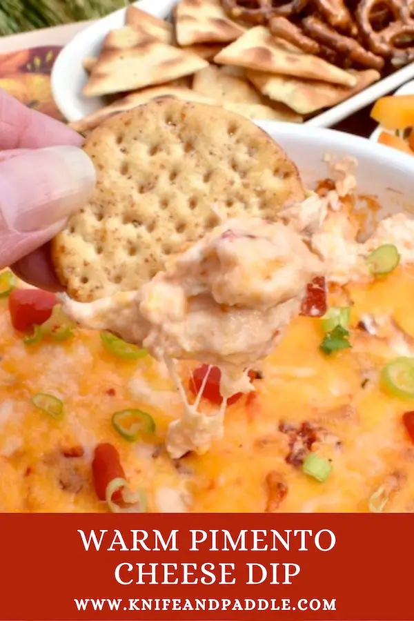Warm Pimento Cheese Dip with crackers, pita chips, pretzels and red, orange and yellow pepper sticks