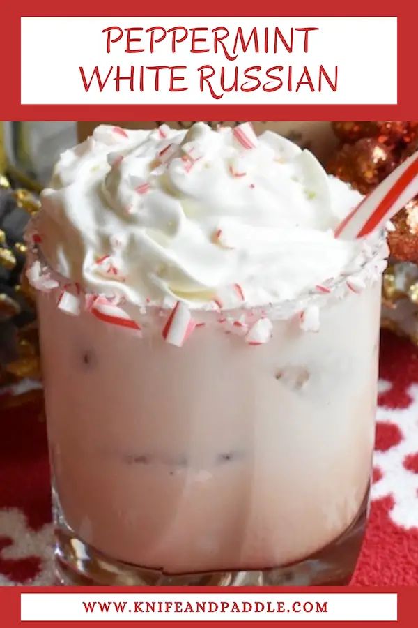 Vodka, Kahlúa, minty schnapps poured and stirred in a lowball glass rimmed with crushed candy canes and topped with whipped cream, crushed candy canes and a candy cane for garnish