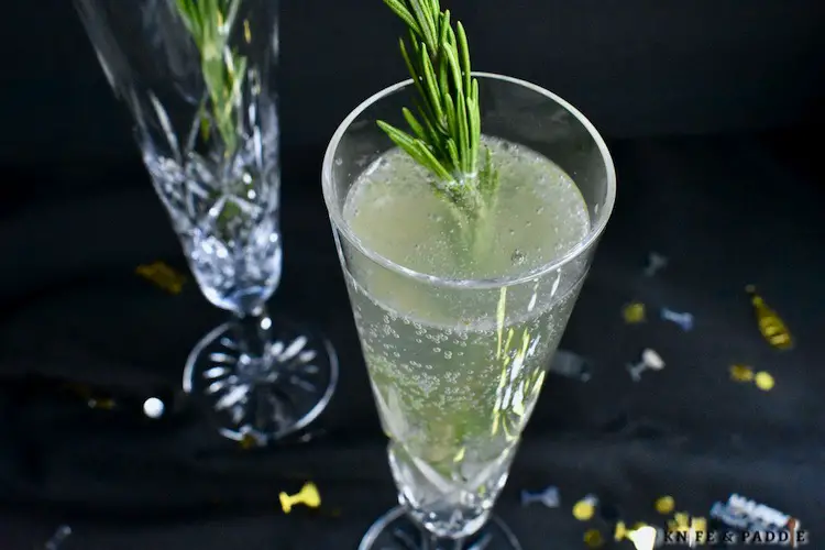Eldeflower liqueur, gin, lemon juice, simple syrup shaken and strained into a flute topped off with prosecco and garnished with a rosemary sprig