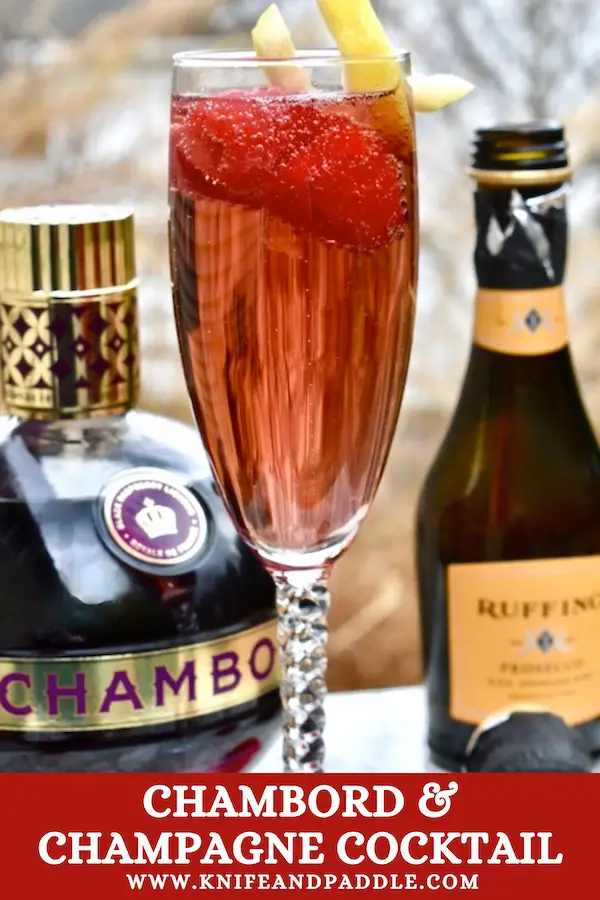 Chambord and Champagne Cocktail topped with fresh raspberries