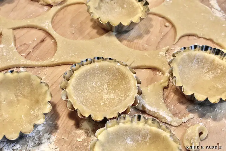 Rolled dough into 1/4 inch and pressed into mini tart pans