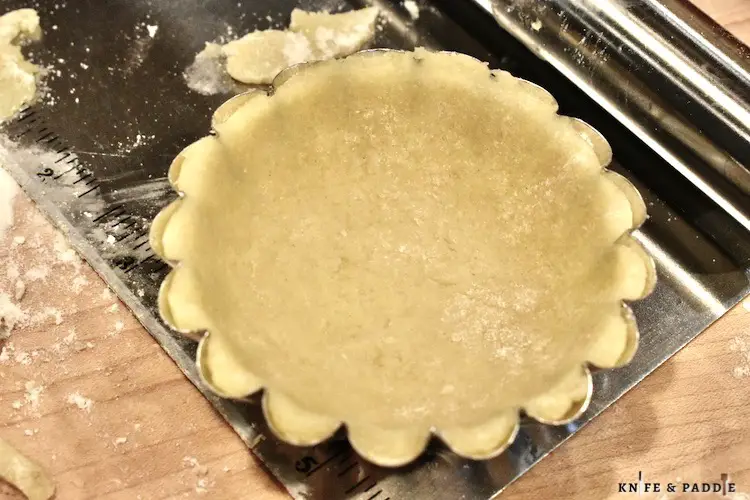 Pressed dough into a mini tart pan