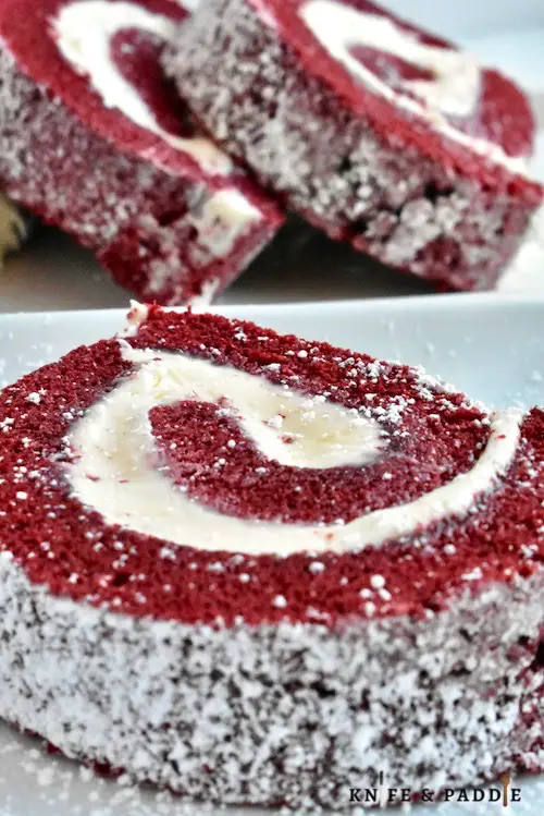 Red Velvet Cake Roll with cream cheese filling and topped with powdered sugar