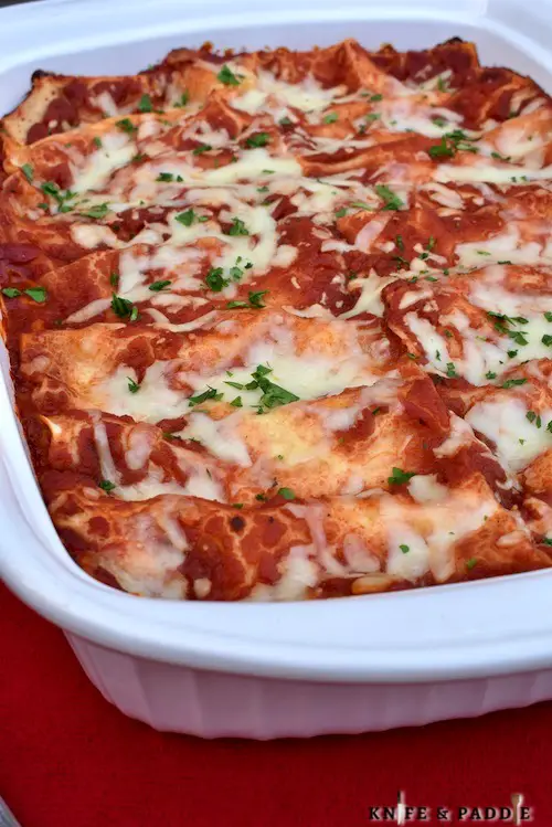 Italian comfort food with noodles, sauce, cheese and parsley baked in a baking dish