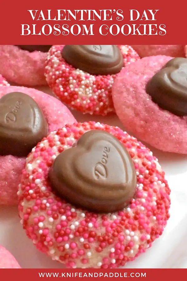 Valentine's Day Blossom Cookies rolled in pink, white and red nonpareils and topped with a Dove chocolate heart