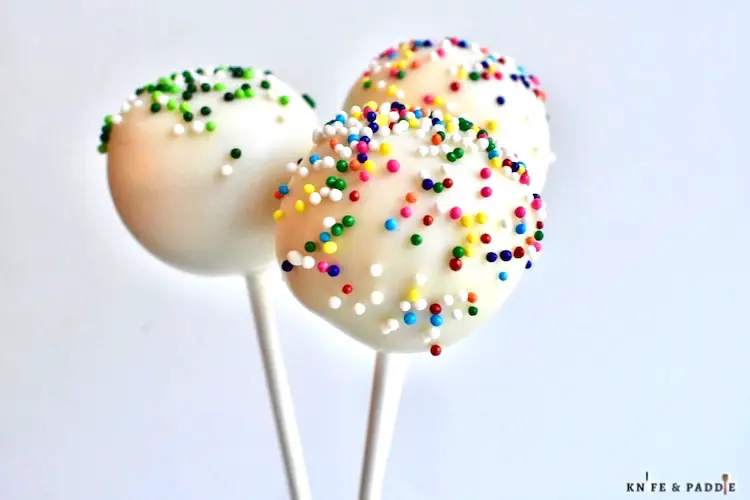 Candy coated bite-sized treats on a stick