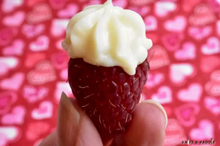 Raspberry filled with cream cheese topping