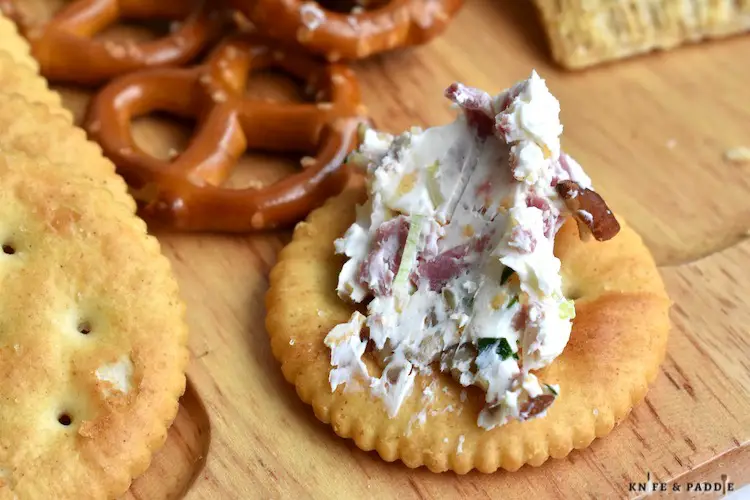 Creamy spread on the top of a cracker 