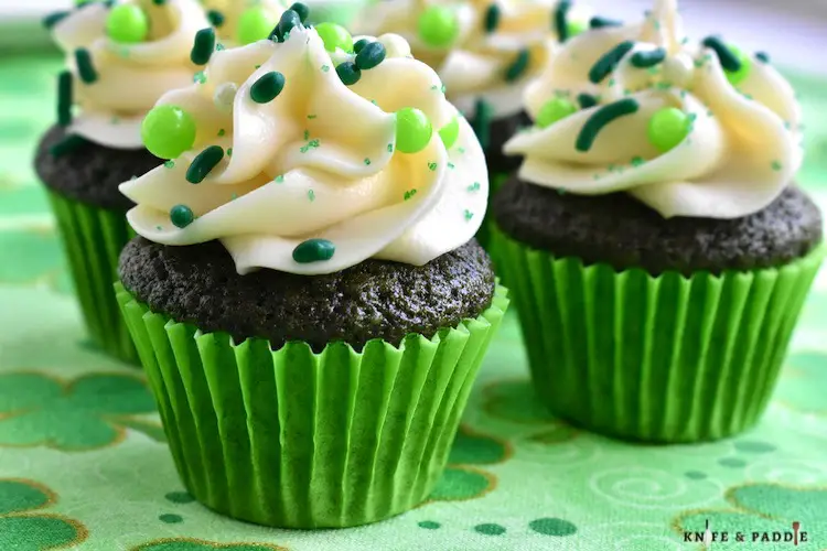 Mini Green Velvet Cupcakes with cream cheese frosting and festive sprinkles