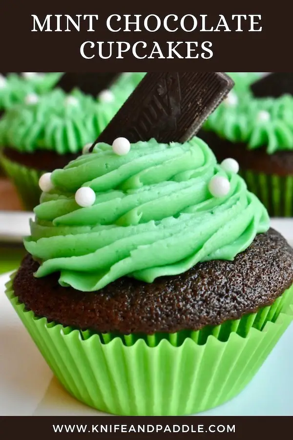Mint Chocolate Cupcakes topped with bright green buttercream frosting, white pearls and an Andes Mint 