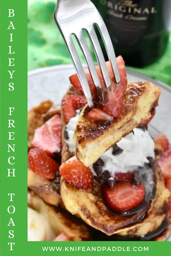 St. Patrick's Day Breakfast Recipe topped with strawberries, whipped cream, chocolate syrup, maple syrup and chocolate chips