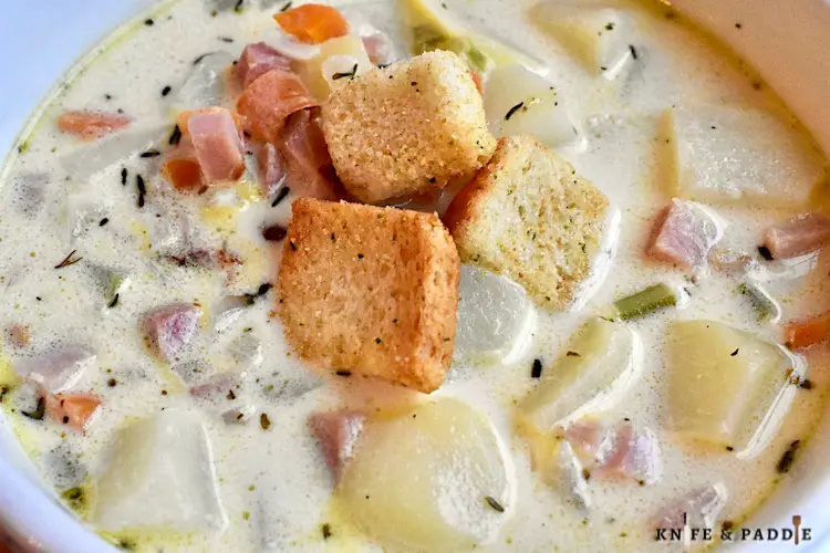 Ham and Potato Soup topped with croutons
