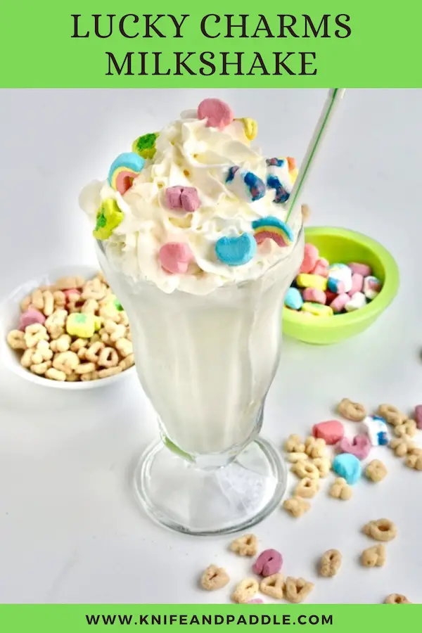 Fun cereal ice cream drink topped with whipped cream and colorful marshmallows