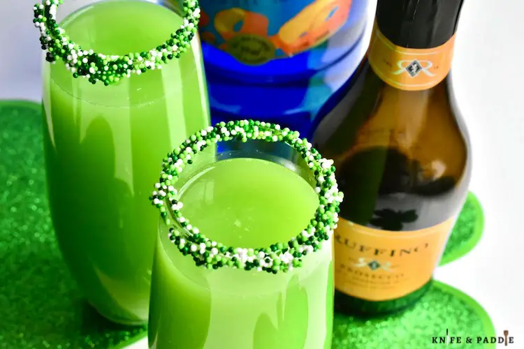 Festive Green Holiday Cocktail served in a Champagne flute 