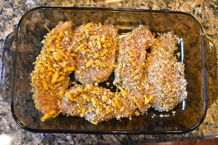Italian seasoned panko bread crumbs on chicken and topped with cheddar cheese
