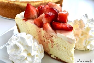 Classic Cheesecake with fresh strawberries and whipped cream
