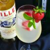 Lillet Spritz garnished with strawberries and mint