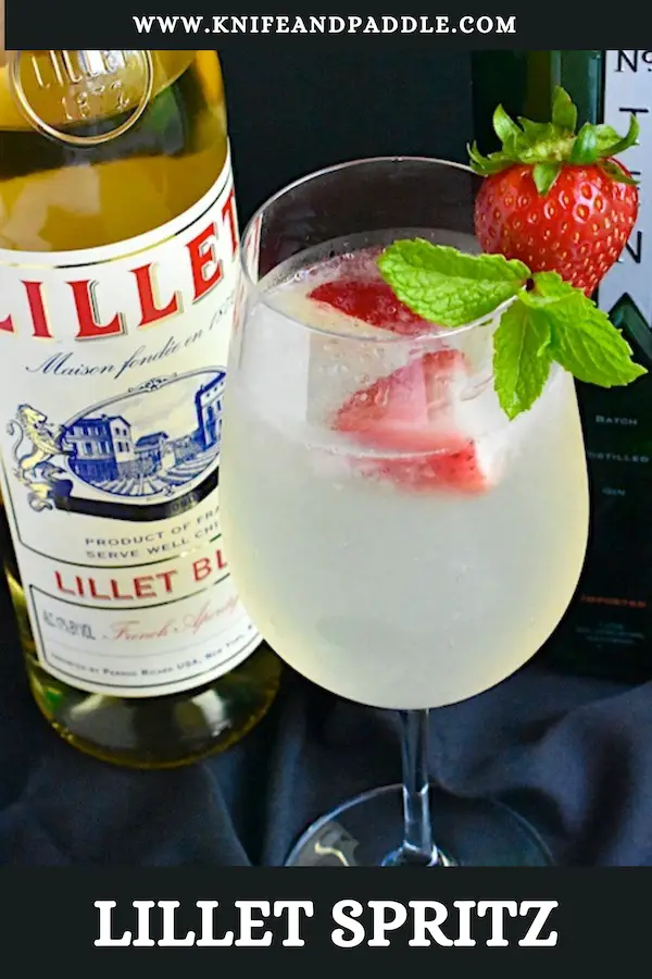 Lillet Spritz with crushed ice and strawberries and mint sprig for garnish