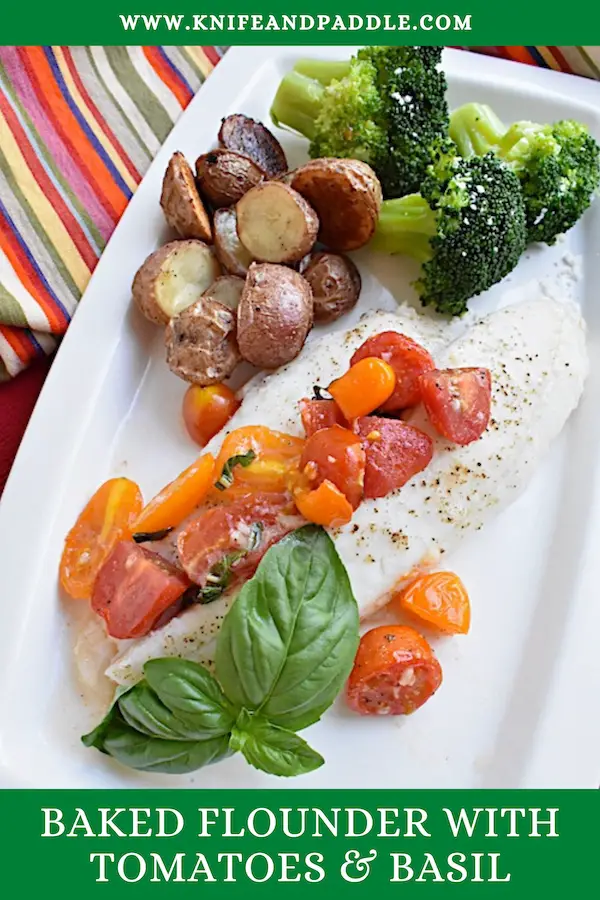 Baked Flounder with Tomatoes and Basil on a plate with roasted potatoes and steamed broccoli