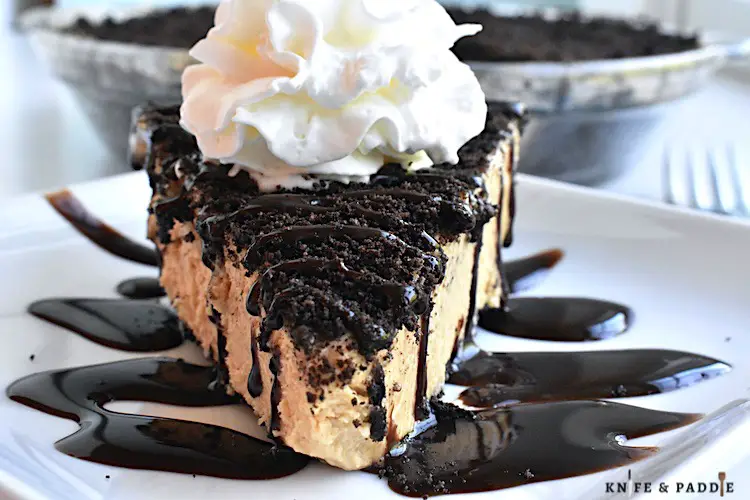 Creamy Peanut Butter Pie with chocolate drizzle and whipped cream