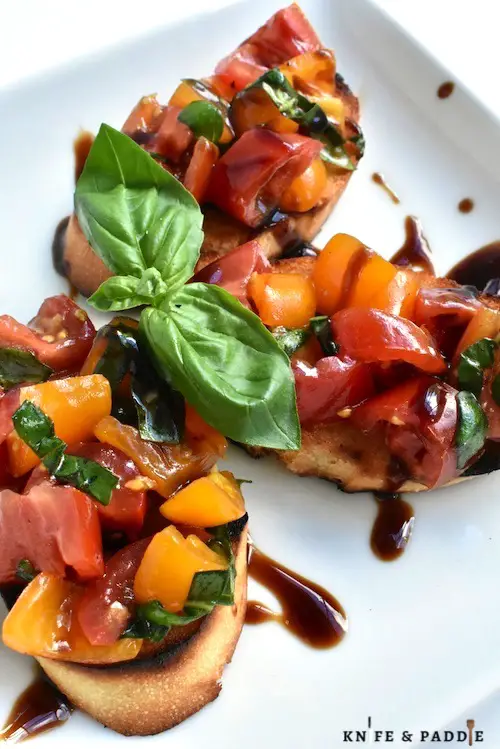 Toasted bread and fresh grape tomatoes with basil and balsamic glaze