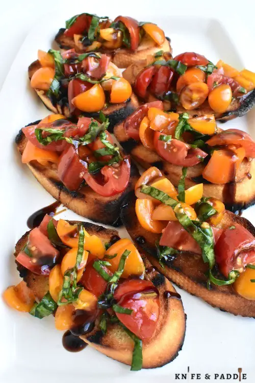 Grilled Bruschetta on a plate with balsamic glaze